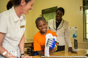 UGANDAN BOY IS VERY HAPPY ABOUT HIS 3D PRINTED TEAM UNLIMBITED E-NABLE ARM